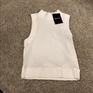 Tight sleeveless sweater tank